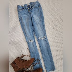Skinny, high rise button fly jeans